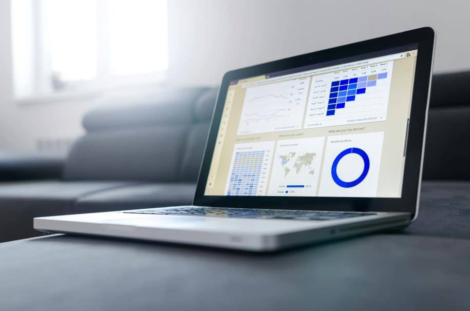 Alt text: Laptop screen displaying live chat monitoring analytics and customer interaction data.